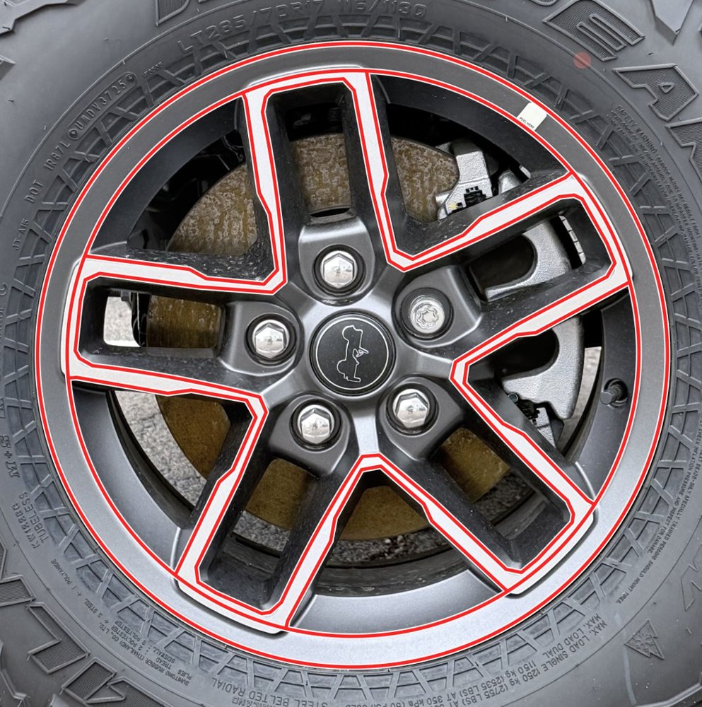 Jeep 5-spoke wheel with red cut lines traced