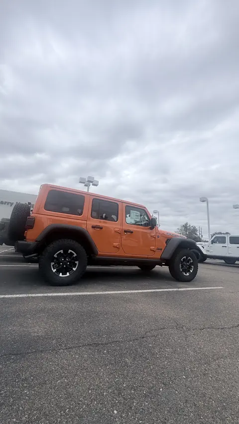 Jeep Wrangler Rubicon — Punisher Orange — Before — stock wheels